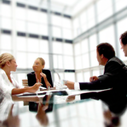description: an image showing a group of professionals discussing financial planning strategies in a modern office setting.description: an anonymous image depicts a group of professionals in a modern office setting, engaged in a discussion about financial planning strategies. the image highlights collaboration, professionalism, and the importance of communication in the investment advisory field.