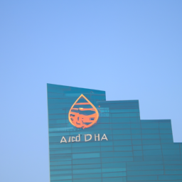 Description: A photo of the Abu Dhabi Investment Authority logo atop a skyscraper in the city of Abu Dhabi.