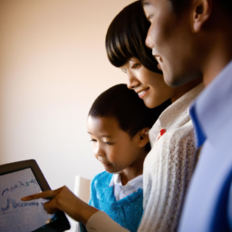 Description: A young family looking over a tablet with a chart depicting the growth of their investment account.