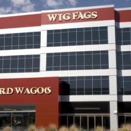 an image of a modern office building, with wells fargo's logo visible on the side. the building appears to be newly renovated and features large windows and sleek architecture.