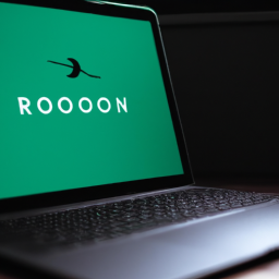 Description: A laptop with a Robinhood logo on the screen.