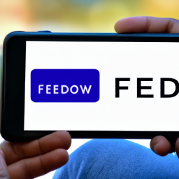 an image of a person using a smartphone to transfer money, with the fednow logo in the background.