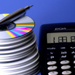 description: a photo of a stack of cds with a calculator and a pen next to it.