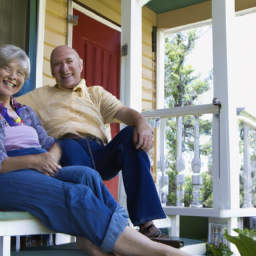 description: an image of a retirement-aged couple sitting on a porch, looking content.