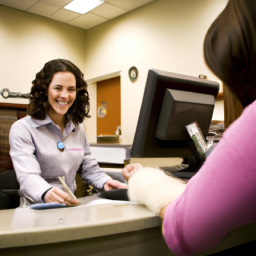 description: a photo of a smiling customer service representative at a signature federal credit union branch, helping a member with their finances.